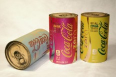Coke Zero Cans, each 12.5" x 7.5" x 7.5", mixed media: screenprints on metalized laminate and cardboard, 2011.
