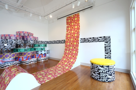 Untitled (Installation from Urban Pop), site specific, dimensions approximately 30' x 20' x 18', mixed media: screenprints on linoleum, glitter, wood, paint, and faux leather vinyl, 2013.